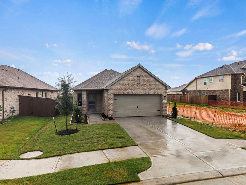 Front exterior of a new home in Creekhaven, Rosharon, TX, highlighting curb appeal (Image 19).