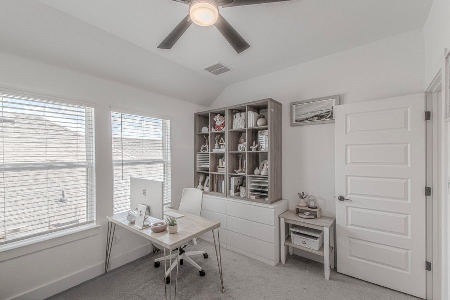 This spacious upstairs bedroom is currently being used as a study.