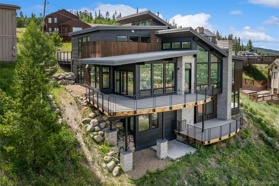 Front exterior of a new home in , Silverthorne, CO, highlighting curb appeal (Image 23).