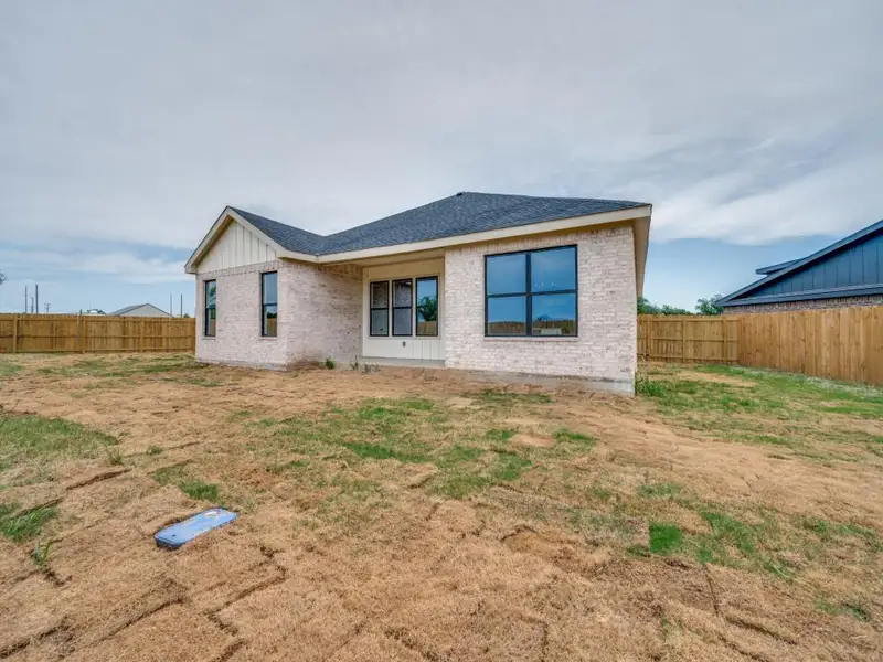 Front exterior of a new home in , De Leon, TX, highlighting curb appeal (Image 2). Front exterior of a new home in , De Leon, TX, highlighting curb appeal (Image 2).