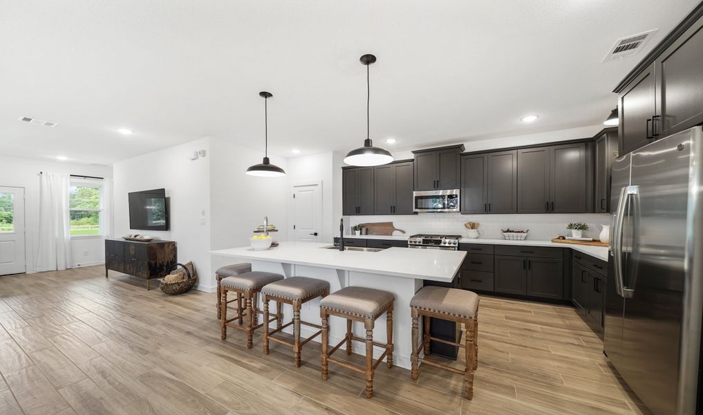 Kitchen with spacious island and stainless appliances