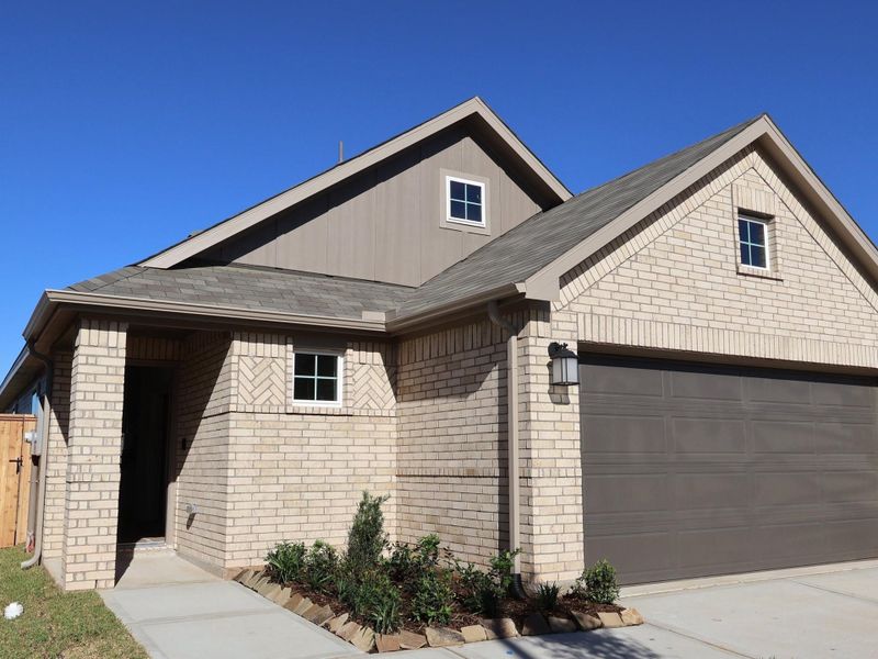 Front exterior of a new home in Lone Star Landing, Montgomery, TX, highlighting curb appeal (Image 7).