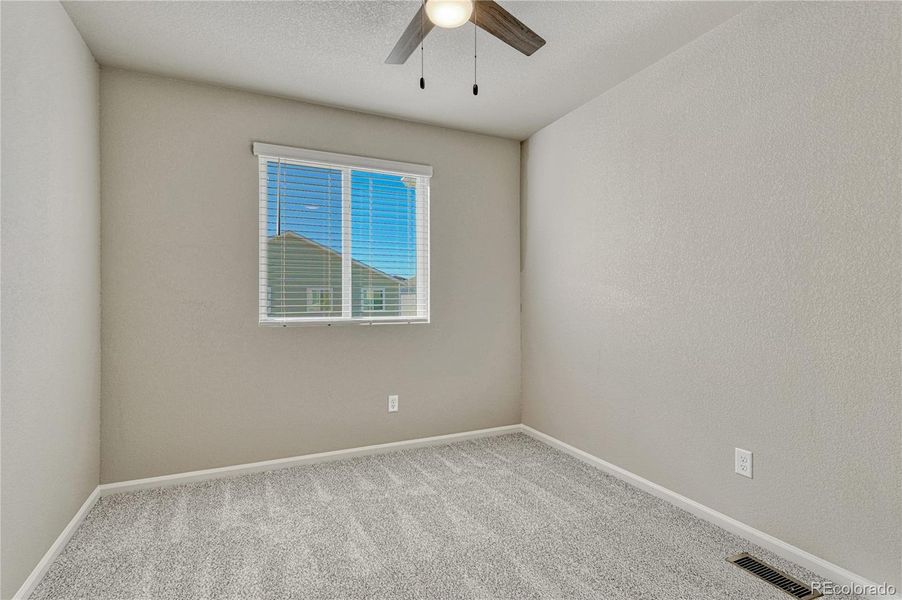Second of two additional upstairs bedrooms.