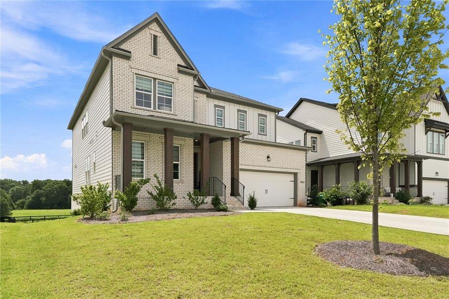 Front exterior of a new home in , Woodstock, GA, highlighting curb appeal (Image 25). Front exterior of a new home in , Woodstock, GA, highlighting curb appeal (Image 25).