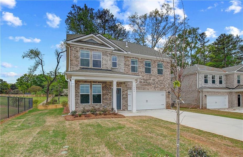 Front exterior of a new home in Burchwood, Stockbridge, GA, highlighting curb appeal (Image 16).