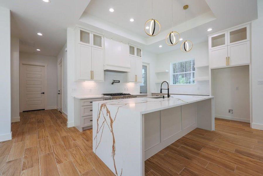 Oversized waterfall kitchen island.