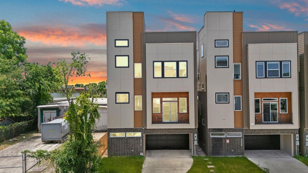 Striking contemporary façade with clean architectural lines, expansive windows and sophisticated urban appeal Striking contemporary façade with clean architectural lines, expansive windows and sophisticated urban appeal