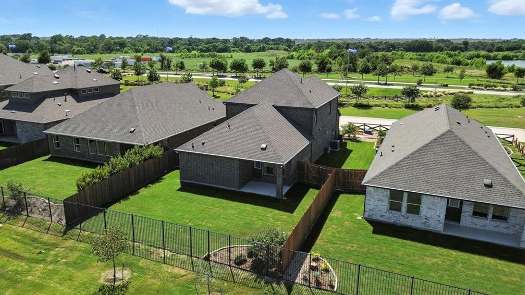 Aerial view of residential area featuring a tree filled landscape