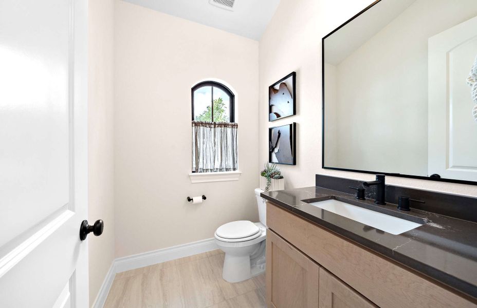 Representative furnished interior of a home built from the 2855 by Ravenna Homes in The Woodlands Hills 65′, Willis (Image 9).