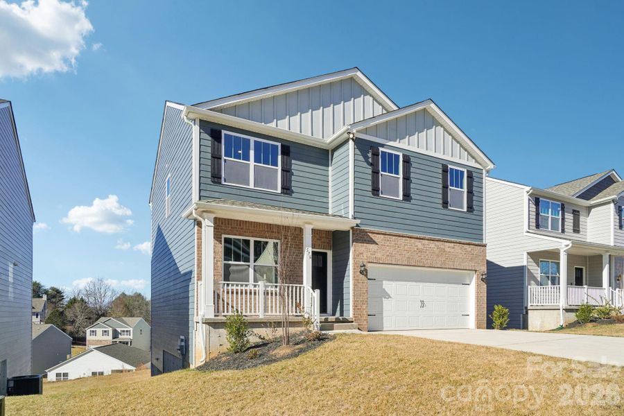 Front exterior of a new home in Rydele Heights, Asheville, NC, highlighting curb appeal (Image 2). Front exterior of a new home in Rydele Heights, Asheville, NC, highlighting curb appeal (Image 2).