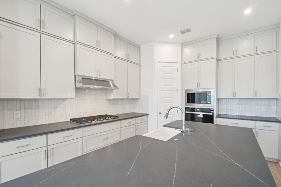 Furnished interior view inside a new home in Persimmon, Buda (Image 4).