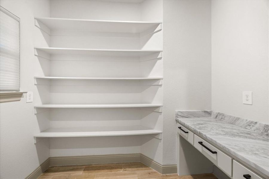 This room just inside the front door could be used as an office or extra storage.