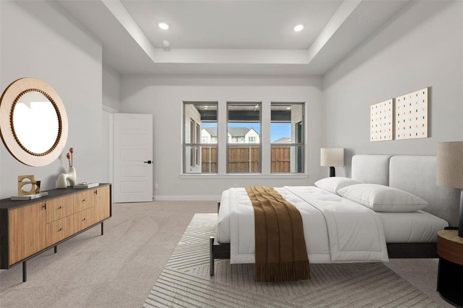 Bedroom featuring light colored carpet, a raised ceiling, and recessed lighting