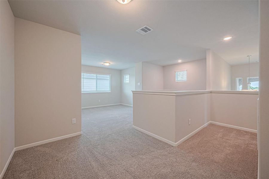 Spacious, unfurnished interior of a new home in Sunterra, Katy (Image 11).