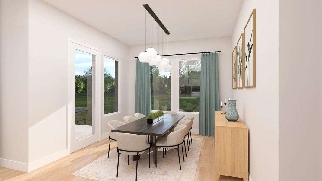 Natural light floods this inviting dining space, featuring hardwood flooring and elegant fixtures. Natural light floods this inviting dining space, featuring hardwood flooring and elegant fixtures.