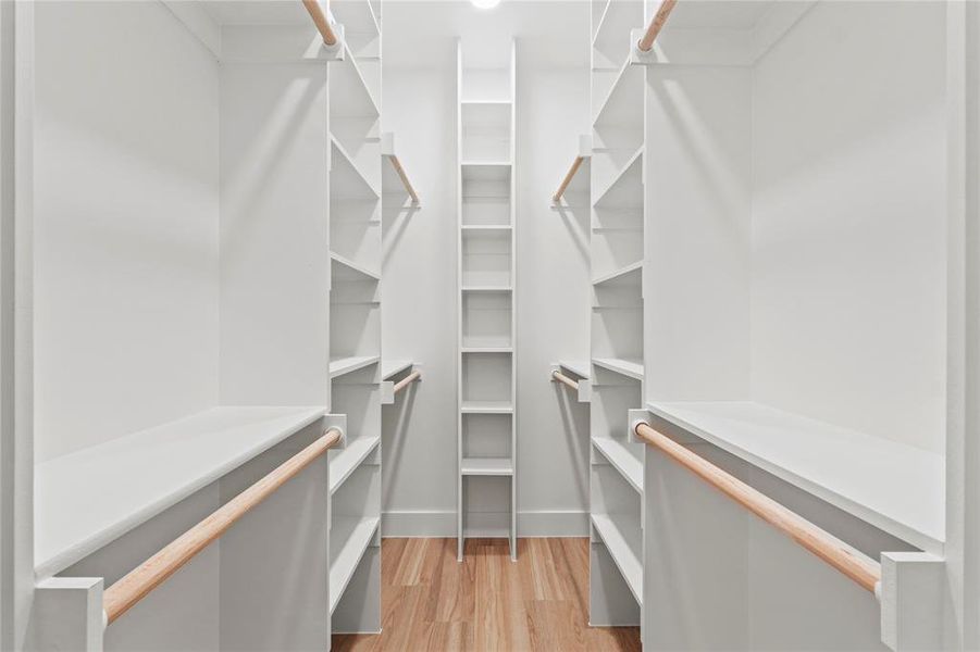 Walk in closet featuring light wood-type flooring