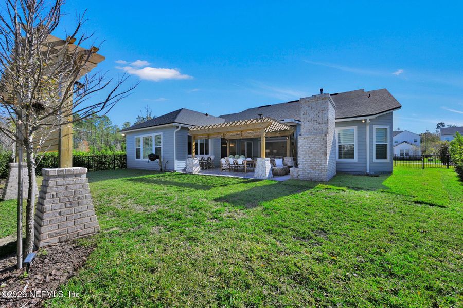 Exterior details and patio area of a home in Palmetto Cove, Ponte Vedra (Image 27).