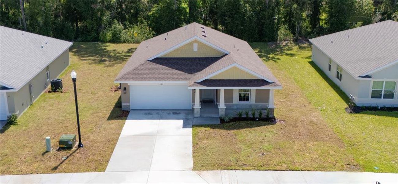 Front exterior of a new home in Oak Hill Plantation, Ocala, FL, highlighting curb appeal (Image 12).