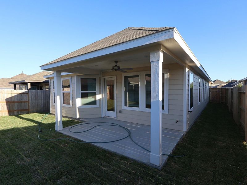 Exterior details and patio area of a home in Pinewood at Grand Texas, New Caney (Image 19).
