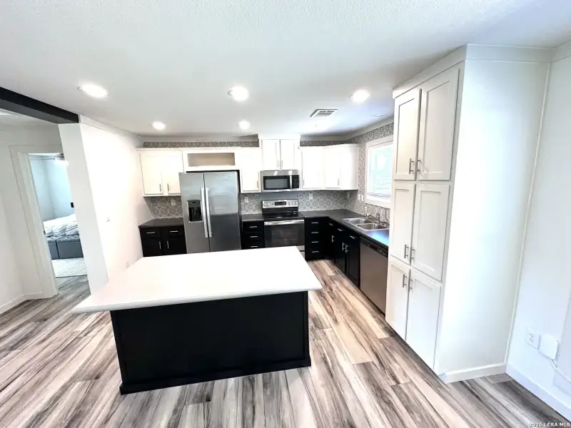Furnished interior view inside a new home in , Lakehills (Image 17).