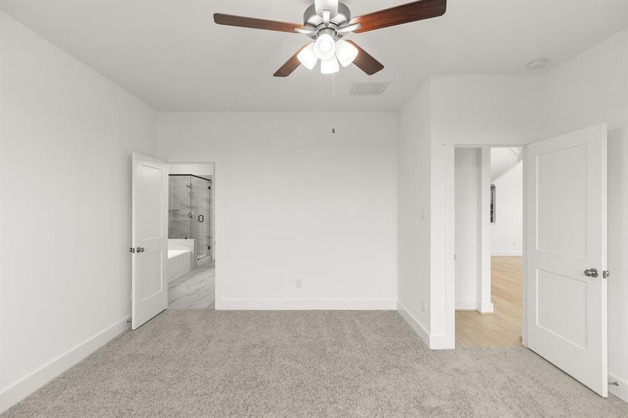 The spacious layout offers plenty of room for a plush king-sized bed, adorned with fluffy pillows and your favorite throws, inviting you to sink in and relax.