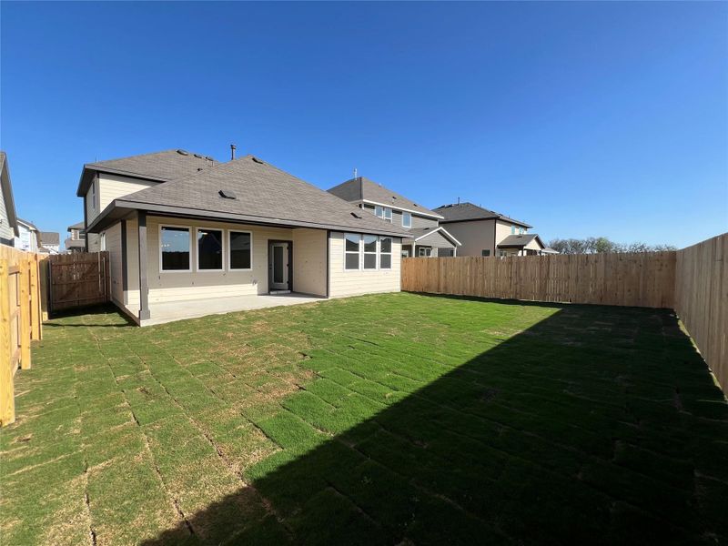 Exterior details and patio area of a home in Rolling Glen, Hutto (Image 4).