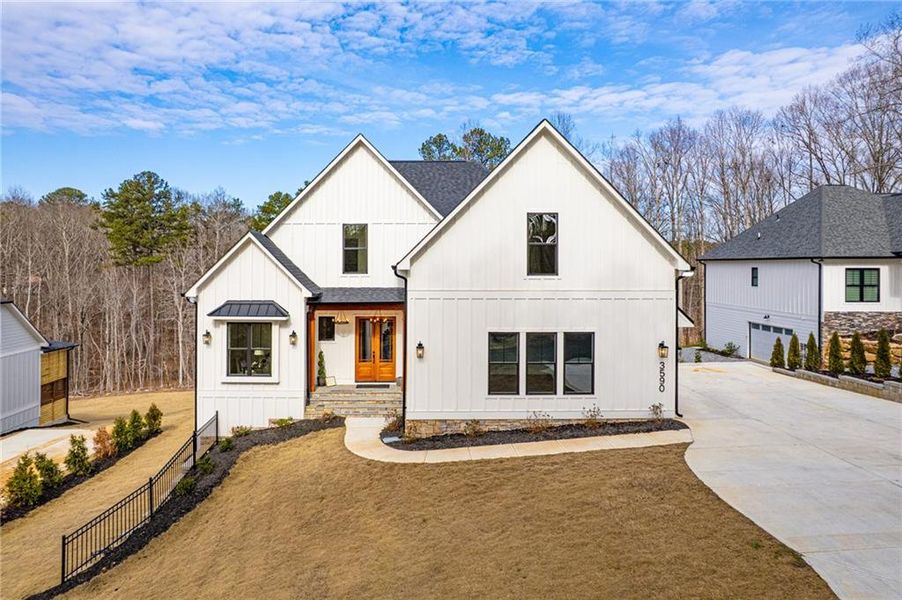 Front exterior of a new home in , Cumming, GA, highlighting curb appeal (Image 2). Front exterior of a new home in , Cumming, GA, highlighting curb appeal (Image 2).