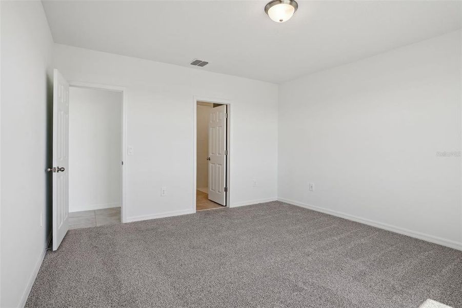 Spacious, unfurnished interior of a new home in Lake Deer Estates - Signature Series, Poinciana (Image 19). Spacious, unfurnished interior of a new home in Lake Deer Estates - Signature Series, Poinciana (Image 19).