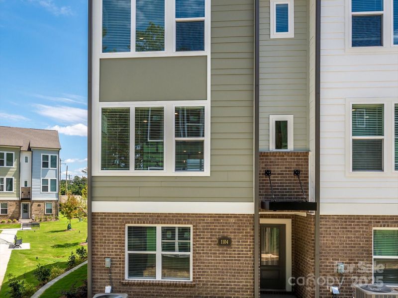 Front exterior of a new home in Central Living at Craig, Charlotte, NC, highlighting curb appeal (Image 20).