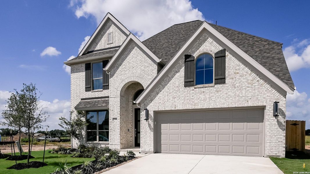 Front exterior of a new home in Legacy at Lake Dunlap, New Braunfels, TX, highlighting curb appeal (Image 2). Front exterior of a new home in Legacy at Lake Dunlap, New Braunfels, TX, highlighting curb appeal (Image 2).