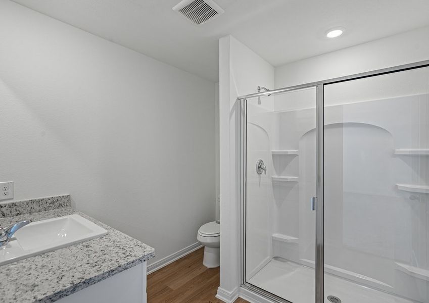 The master bathroom with a step-in shower