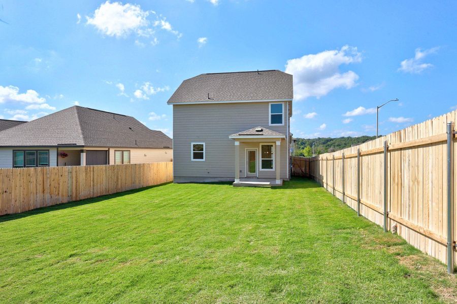Front exterior of a new home in Retreat at San Gabriel, Georgetown, TX, highlighting curb appeal (Image 1).