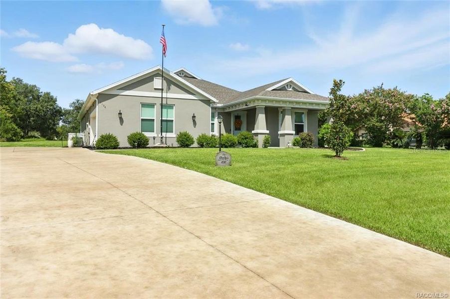 Front exterior of a new home in Clearview Estates, Hernando, FL, highlighting curb appeal (Image 23).