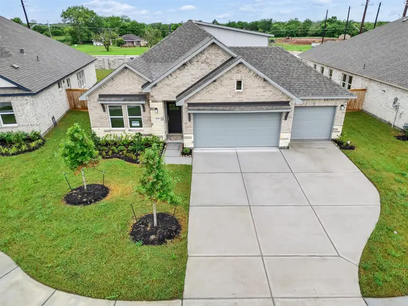 Front exterior of a new home in , Angleton, TX, highlighting curb appeal (Image 1). Front exterior of a new home in , Angleton, TX, highlighting curb appeal (Image 1).