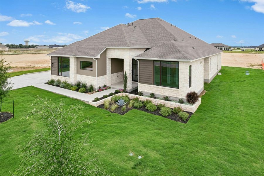 Front exterior of a new home in Leander Estates, Leander, TX, highlighting curb appeal (Image 1). Front exterior of a new home in Leander Estates, Leander, TX, highlighting curb appeal (Image 1).