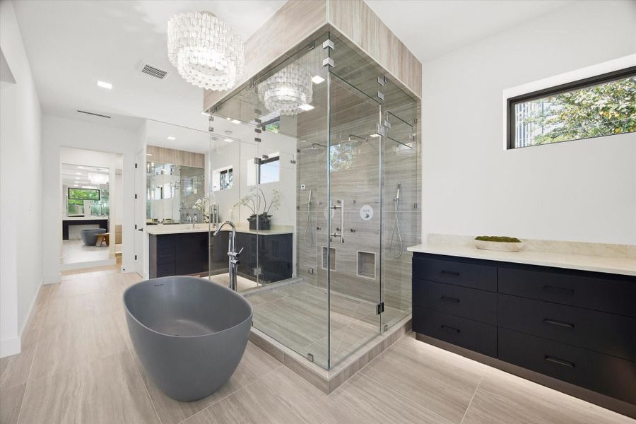 Dual vanities span each side of the space, offering both functionality and a balanced, architectural design.