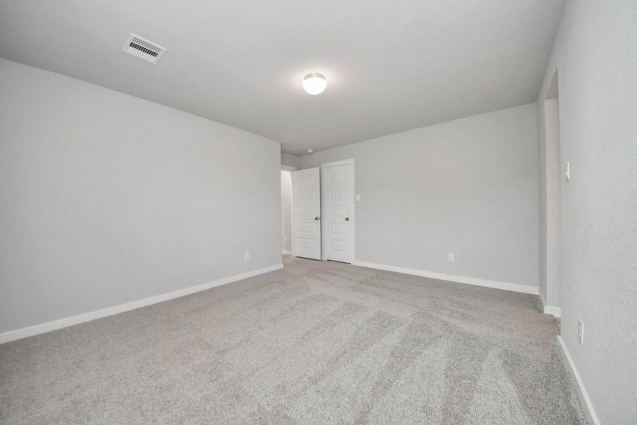 Generously sized secondary bedrooms featuring spacious closets, soft and inviting carpetingunderfoot, large windows allowing plenty of natural light, and the added touch of privacyblinds for your personal retreat.