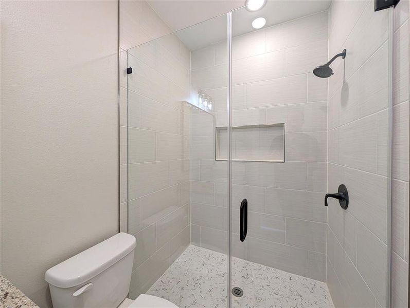 Full bathroom with a stall shower and recessed lighting Full bathroom with a stall shower and recessed lighting
