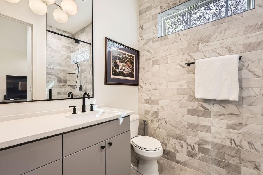 Conveniently located next to the full bathroom, providing privacy and easy access for guests.