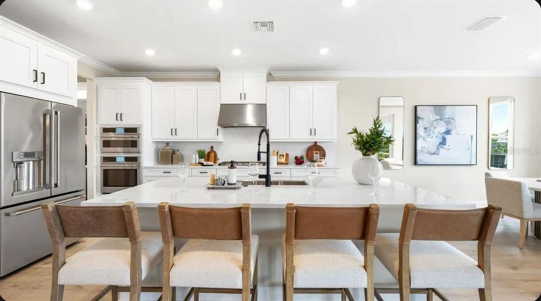 Furnished interior view inside a new home in Coasterra Community Group Page, Palmetto (Image 12).