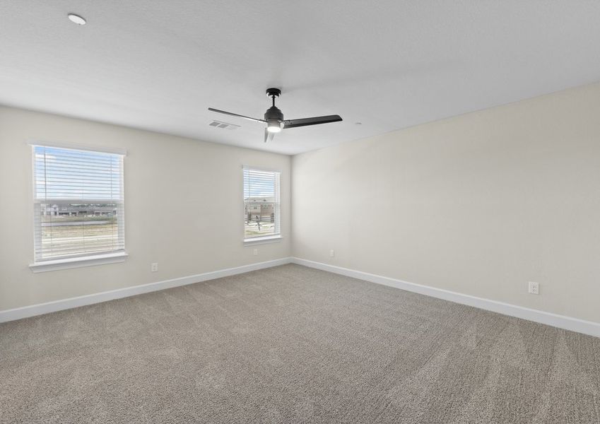 The master bedroom has large windows that let in great, natural light.