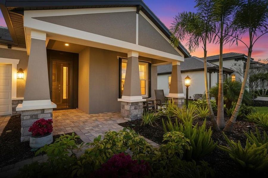 Exterior details and patio area of a home in Cypress Glen at River Wilderness, Parrish (Image 22).