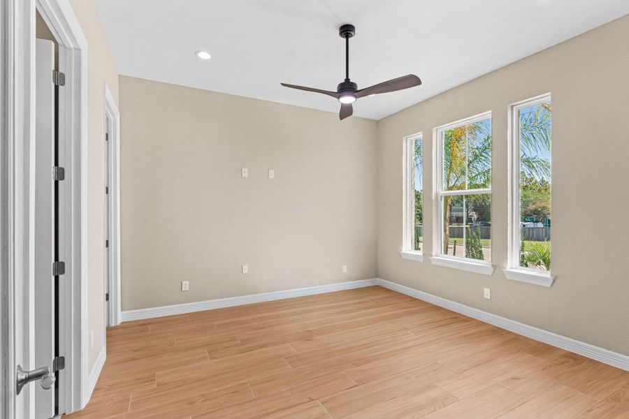 Beautifully designed flex room perfect for a home office or private guest suite. Features a closet and full ensuite bath, offering comfort and versatility.