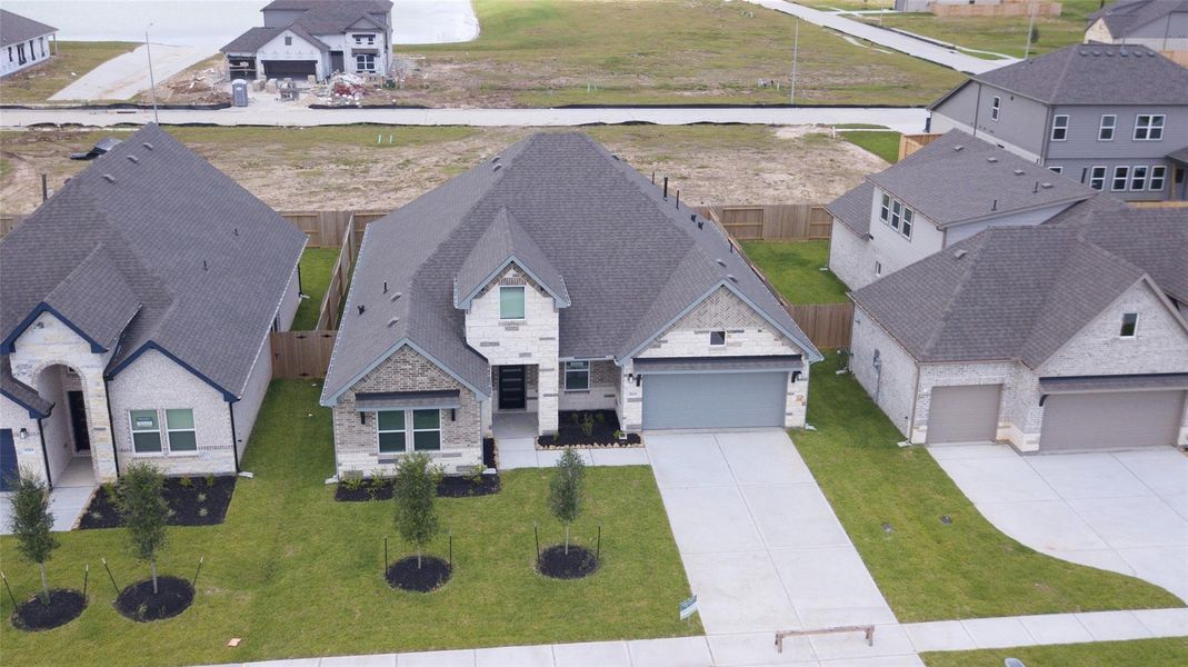 Front exterior of a new home in , Alvin, TX, highlighting curb appeal (Image 2). Front exterior of a new home in , Alvin, TX, highlighting curb appeal (Image 2).