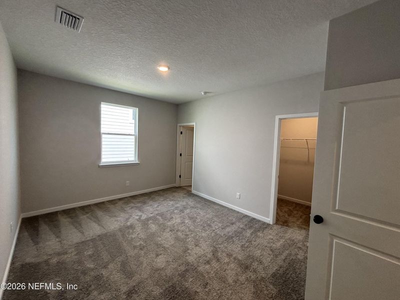 Spacious, unfurnished interior of a new home in The Cypress Series at Reserve East, Flagler Beach (Image 13).