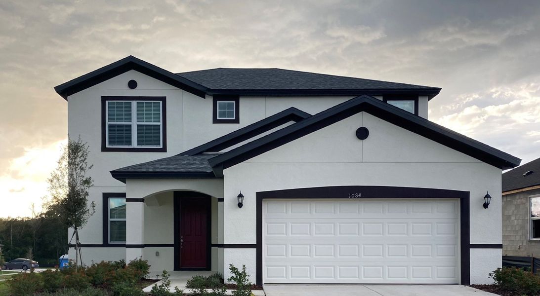 Representative exterior photo of a completed home built from the 50 ' - Saratoga by William Ryan Homes in Pinecone Reserve, Brooksville, FL (Image 32).