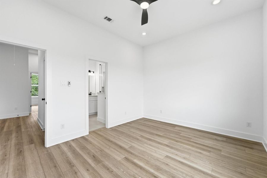 This third-floor primary retreat with bright windows, ceiling fan, and en-suite bath access offers the ultimate in privacy, quiet, and comfort at the top of your new home. This third-floor primary retreat with bright windows, ceiling fan, and en-suite bath access offers the ultimate in privacy, quiet, and comfort at the top of your new home.