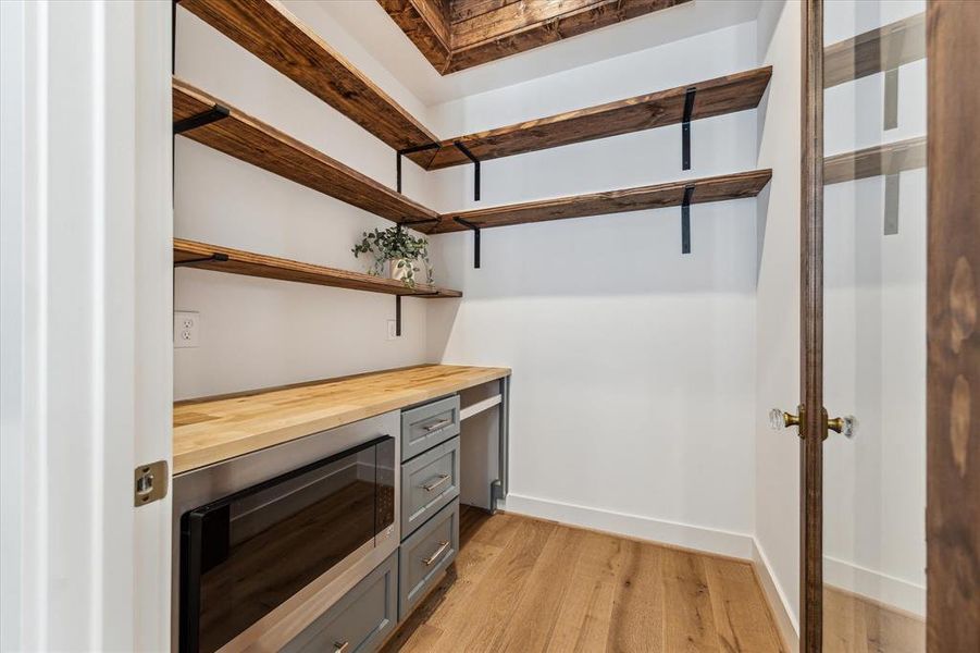 Large butler's pantry featuring a built-in microwave and wine fridge (to be installed)