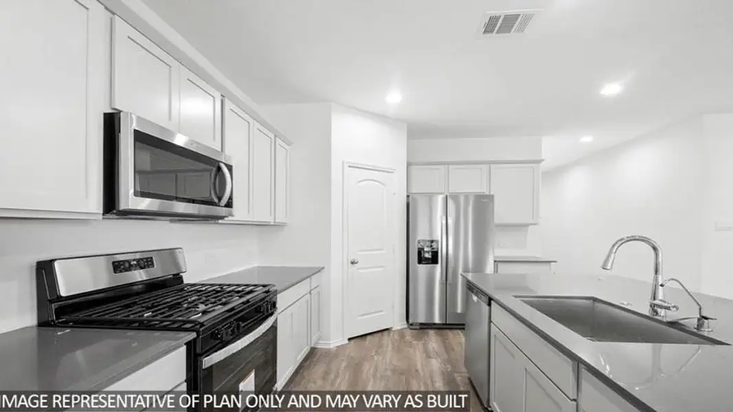 Furnished interior view inside a new home in Sunterra, Katy (Image 9).