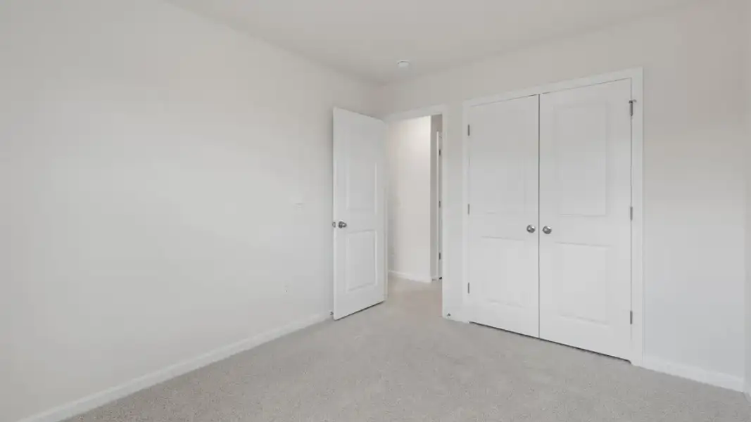 Spacious, unfurnished interior of a new home in The Townes at Galvins Ridge, Sanford (Image 20).
